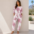 Women's blush pink tie-dye matching lounge set with short sleeve top and comfortable jogger pants.