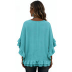 Back view of the women's emerald green boho lace trim tassel tie V-neck blouse with layered ruffle sleeves and a relaxed silhouette.
