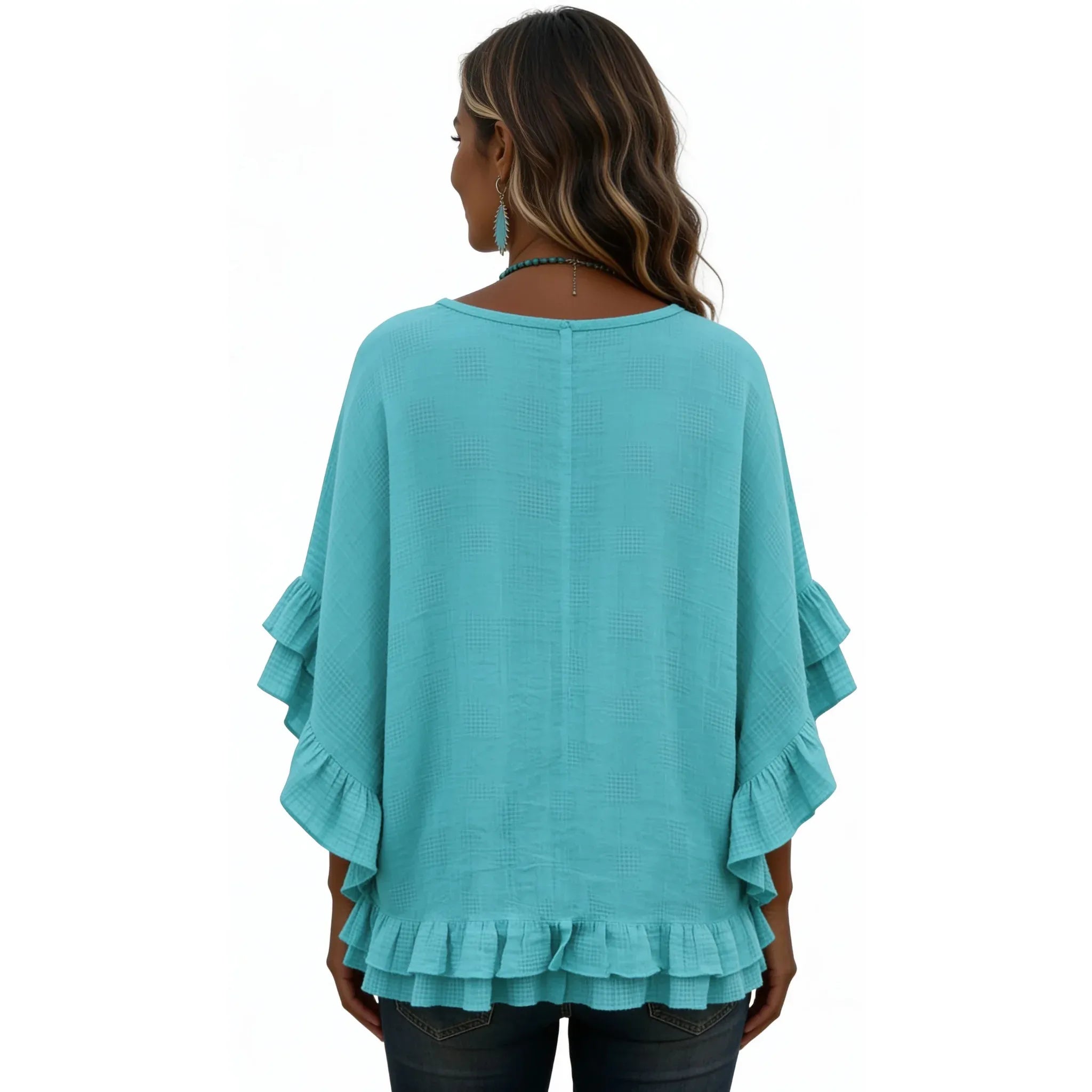 Back view of the women's emerald green boho lace trim tassel tie V-neck blouse with layered ruffle sleeves and a relaxed silhouette.