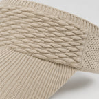 Close-up of the khaki knit sun visor highlighting the textured cable knit pattern, breathable mesh sides, and curved brim.