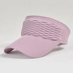 Pink breathable knit sun visor hat with a cable knit texture, open-top design, and comfortable stretch fit.