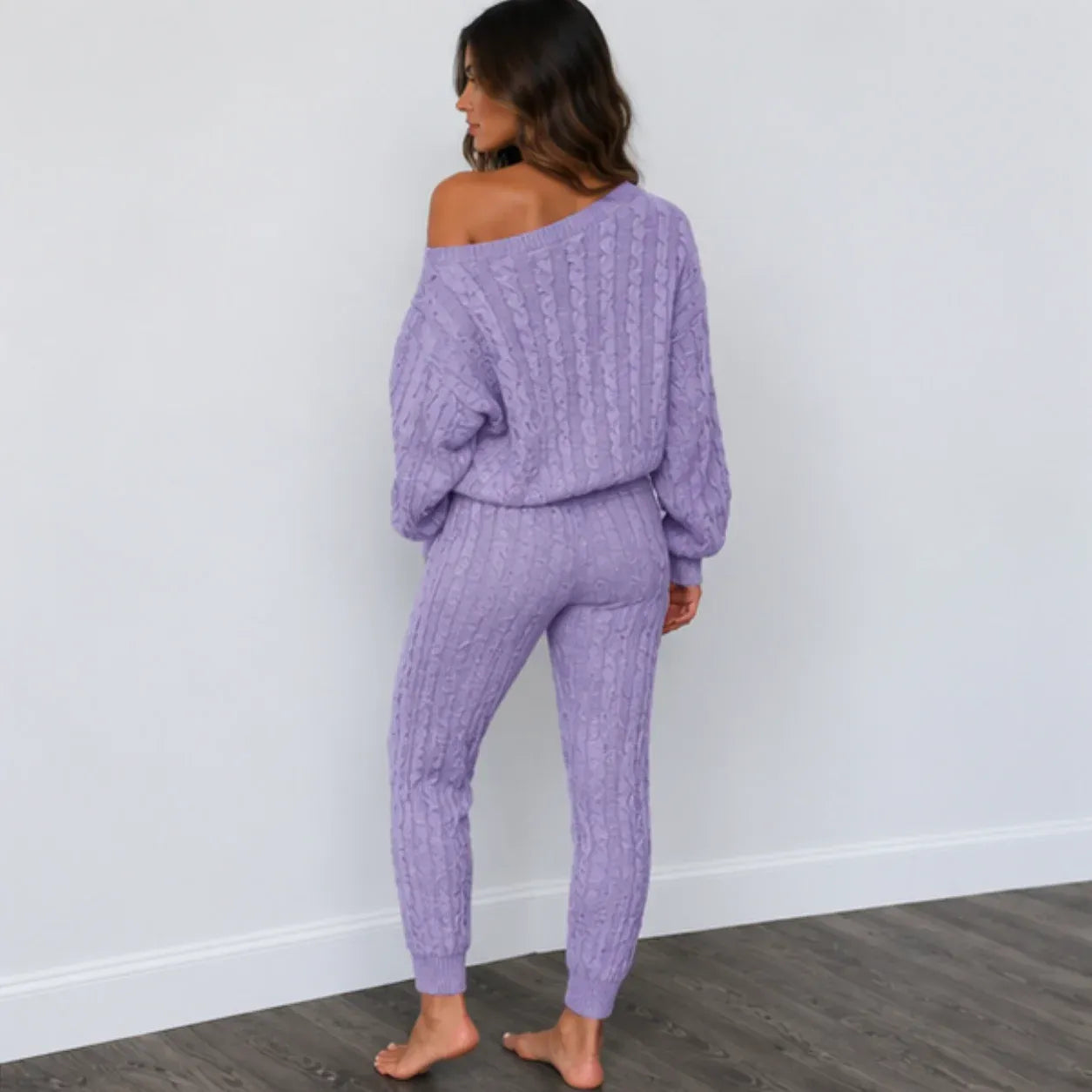 Back view of light purple cable knit sweater and pants set for women