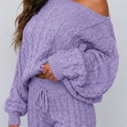 Close-up view of light purple cable knit sweater and pants set showing knit texture