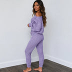 Side view of light purple cable knit sweater and pants set for women