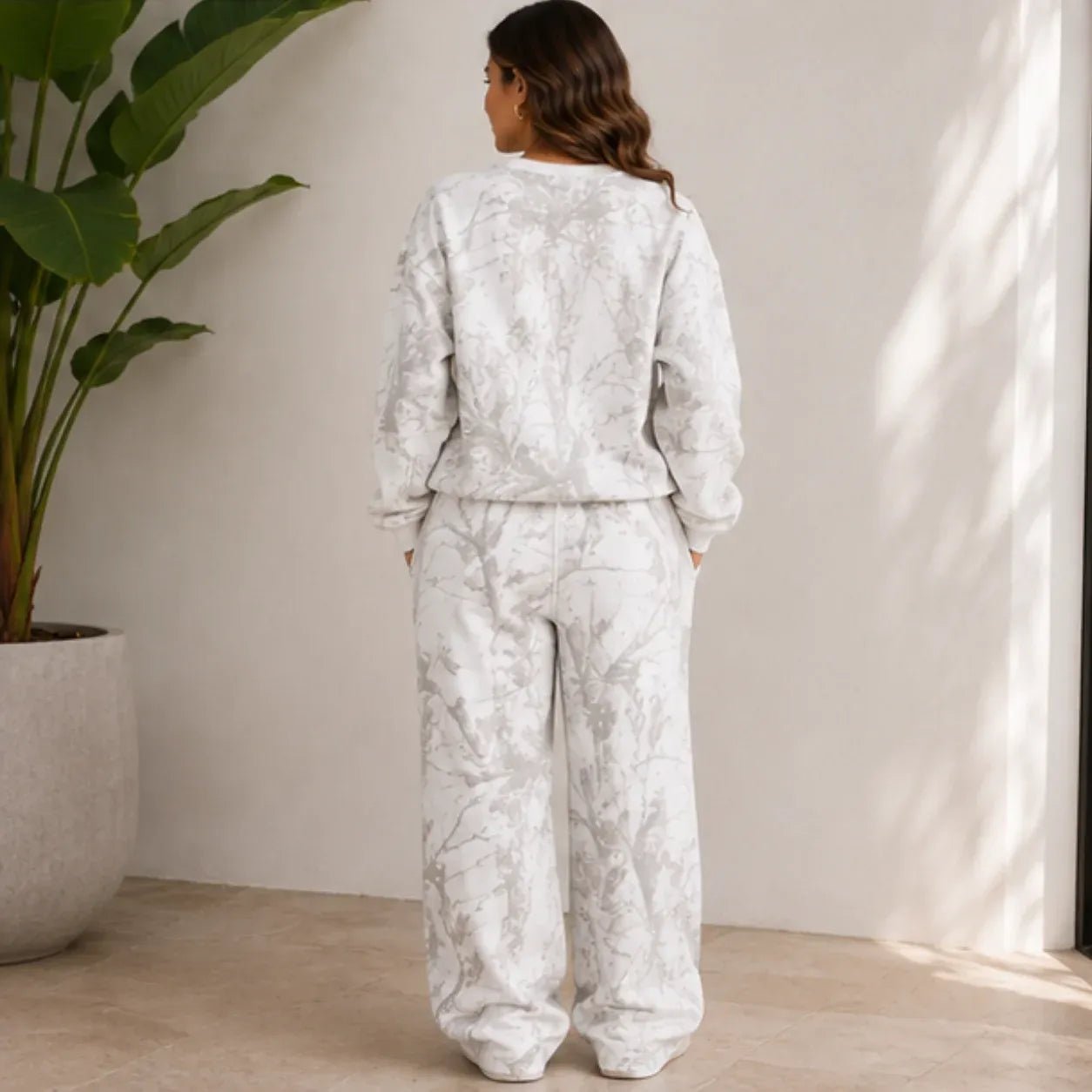 Camo maple leaf crewneck sweatshirt and sweatpants set shown from the back