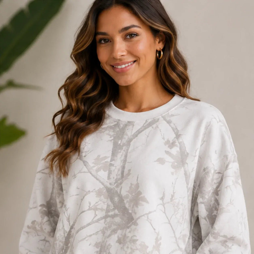 Close-up view of the camo maple leaf print crewneck sweatshirt
