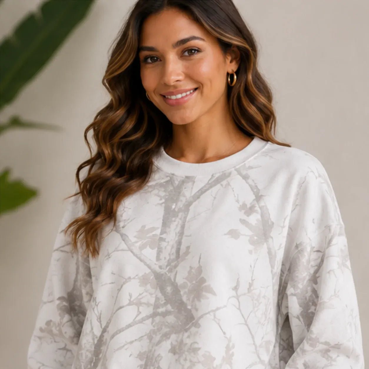 Close-up view of the camo maple leaf print crewneck sweatshirt