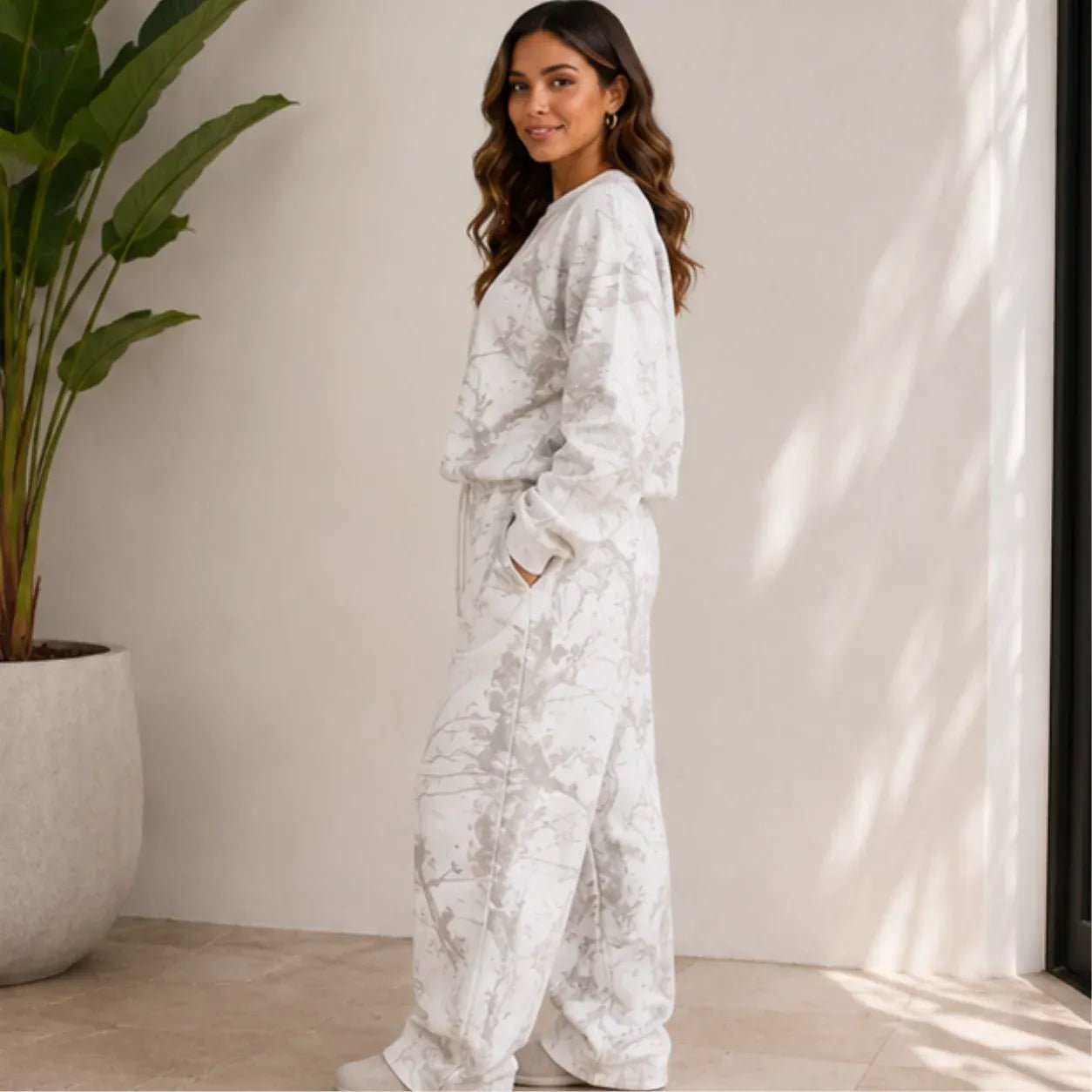 Camo maple leaf crewneck sweatshirt and sweatpants set shown from the side