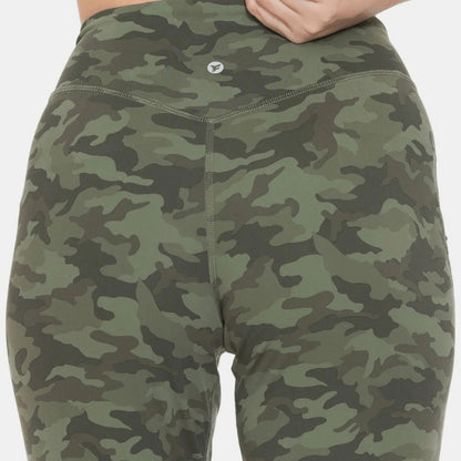Logo view of high-waist camo leggings highlighting the flattering smoothing waistband.