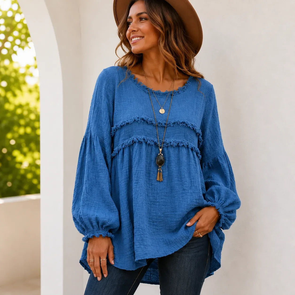 Women's blue Casual Long Sleeve Fringe Tassel Top with textured woven fabric, fringe tassel detailing, long balloon sleeves, and relaxed boho silhouette.