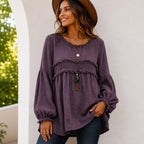 Women's purple Casual Long Sleeve Fringe Tassel Top featuring textured woven fabric, fringe tassel detailing, long balloon sleeves, and a flowy silhouette.