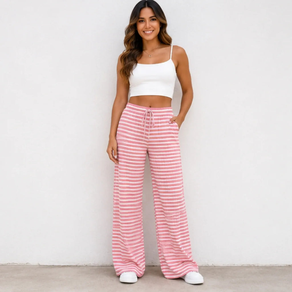 Woman wearing pink and white striped drawstring straight-leg pants with pockets