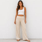 Model wearing apricot and white striped casual wide-leg pants