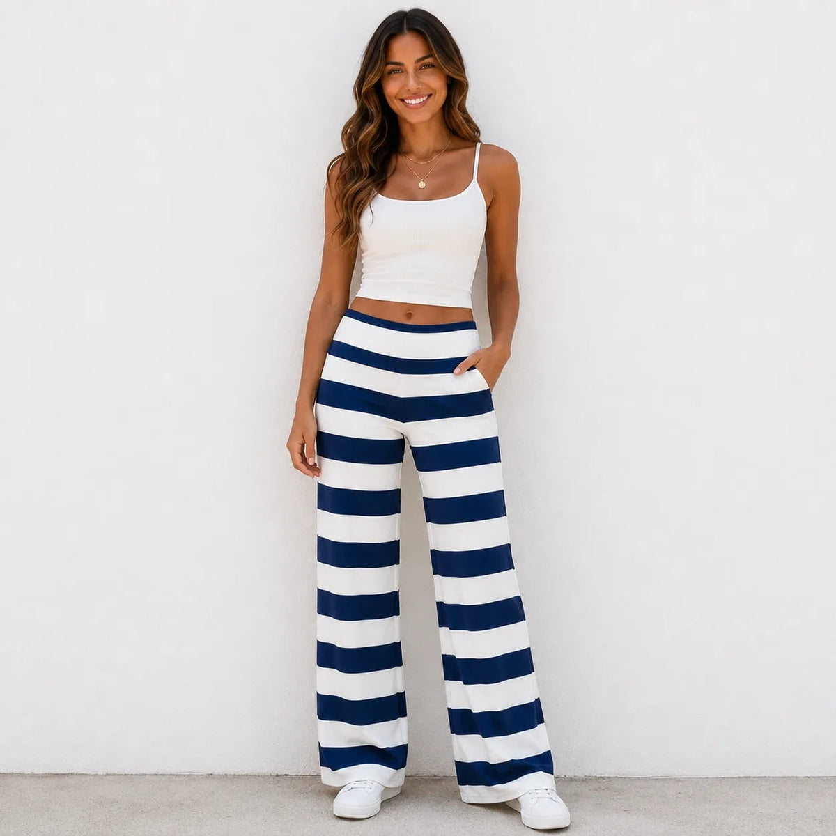 Model wearing dark blue and white striped casual wide-leg pants