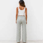Back view of casual light green and white striped wide-leg pants