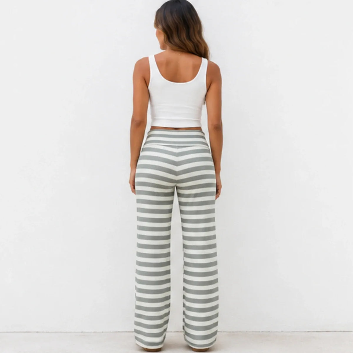 Back view of casual light green and white striped wide-leg pants