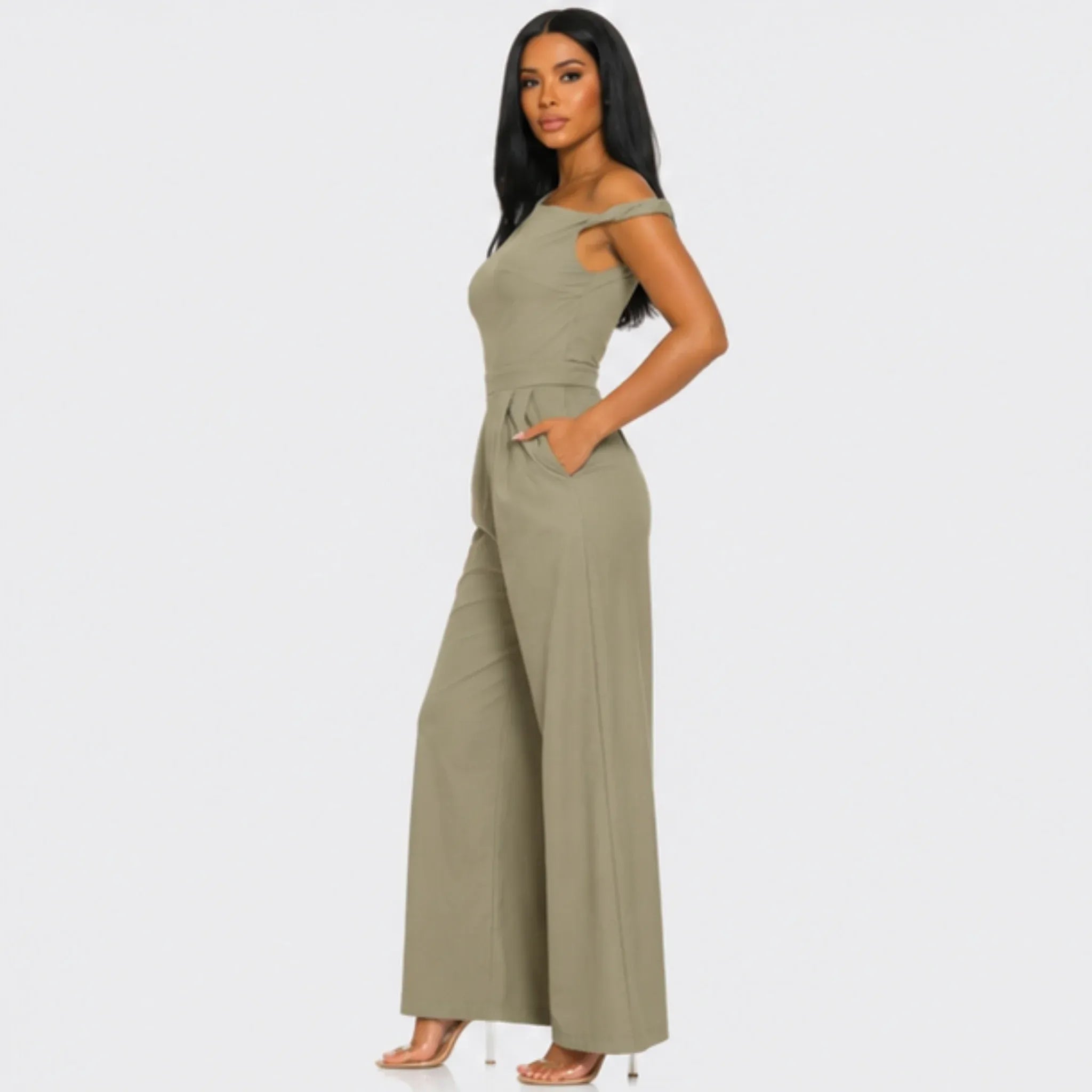 Side profile of the Chic Poise One-Shoulder Jumpsuit in khaki featuring an asymmetrical neckline, tailored waist, side pockets, and wide-leg fit.