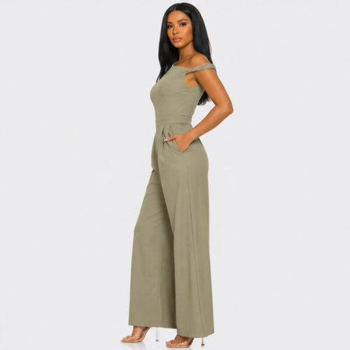 Side profile of the Chic Poise One-Shoulder Jumpsuit in khaki featuring an asymmetrical neckline, tailored waist, side pockets, and wide-leg fit.