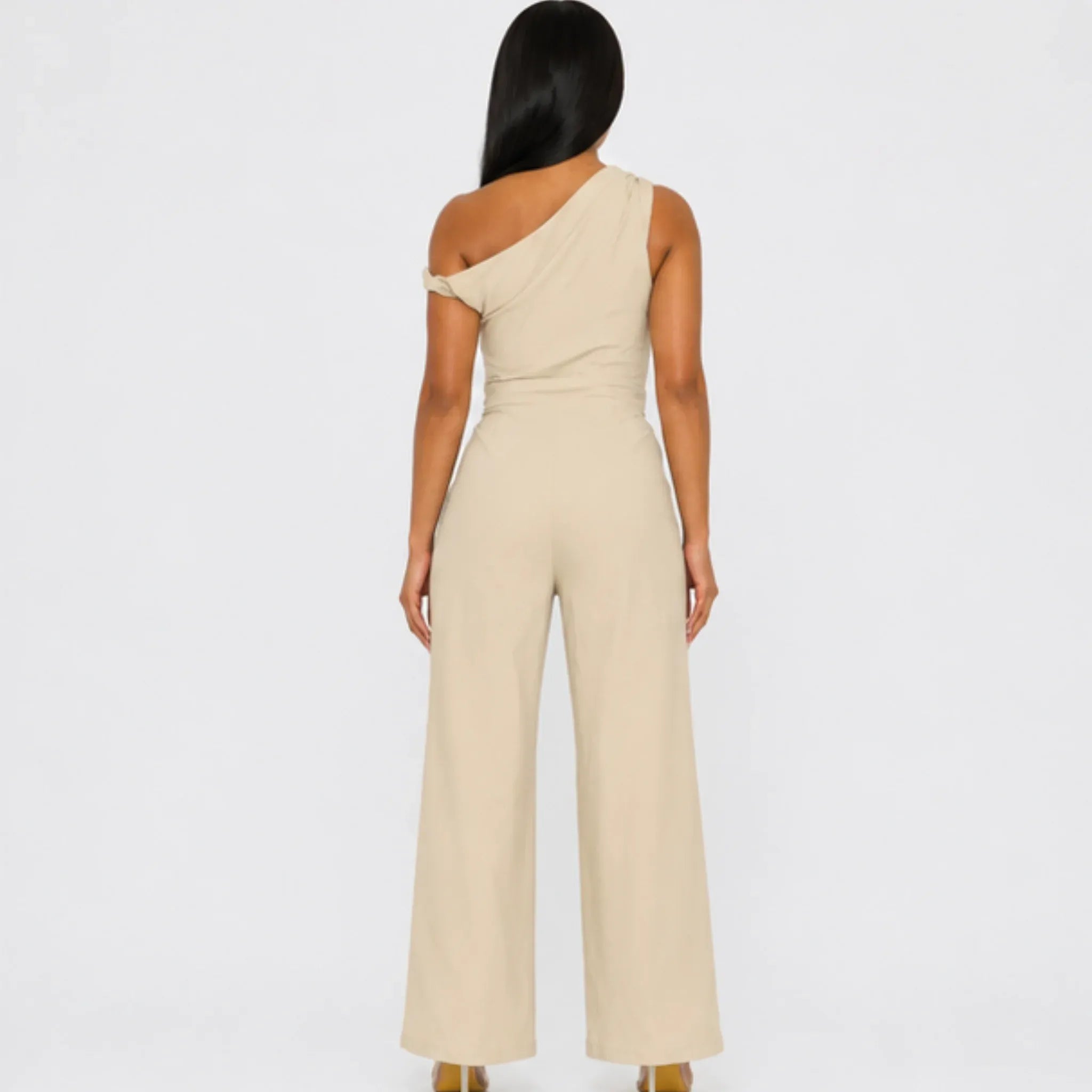 Chic Poise One-Shoulder Jumpsuit in stone featuring an asymmetrical neckline, tailored waist, wide-leg silhouette, and side pockets, front view.