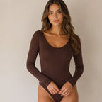 Women's chocolate brown scoop neck long sleeve bodysuit with fitted silhouette and snap closure.