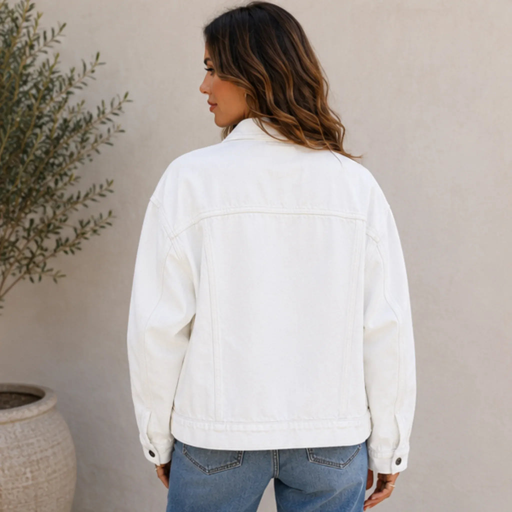 Back view of the white Classic Button Front Oversized Denim Jacket with an oversized fit, long sleeves, and timeless denim construction.