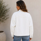 Back view of the white Classic Button Front Oversized Denim Jacket with an oversized fit, long sleeves, and timeless denim construction.