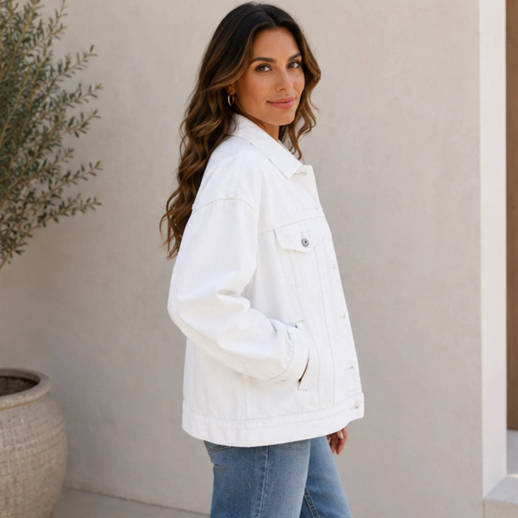 Side view of the white Classic Button Front Oversized Denim Jacket showcasing the relaxed oversized silhouette, dropped shoulders, and classic denim styling.