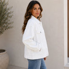 Side view of the white Classic Button Front Oversized Denim Jacket showcasing the relaxed oversized silhouette, dropped shoulders, and classic denim styling.