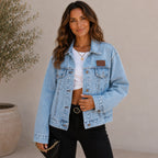 Front view of the women's Classic Loose Fit Denim Jacket in light blue featuring a relaxed fit, button-front closure, lapel collar, and everyday casual style.