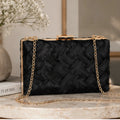 Front view of the Crosshatch Chain Clutch Bag in black featuring an intricate woven satin exterior, gold-tone frame clasp, and detachable chain strap.