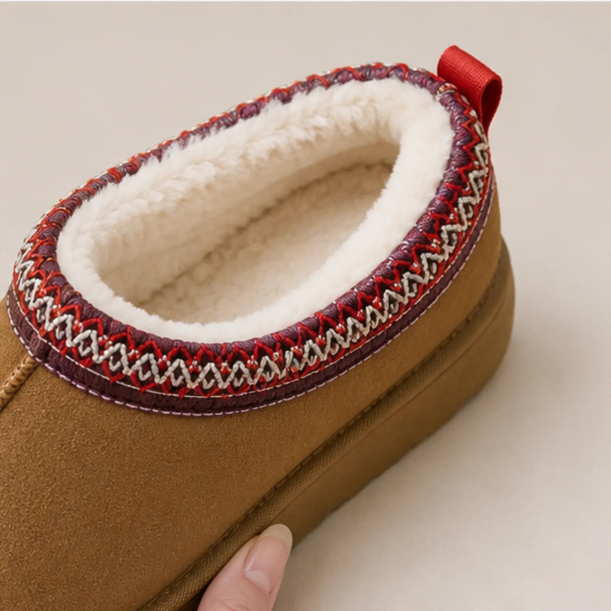Close-up of brown Cozy Fleece-Lined House Slippers featuring a luxurious fleece lining, embroidered collar detail, and durable platform sole.