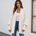 Women's apricot cozy knitted lapel cardigan sweater featuring an oversized fit, textured knit, and open-front design.