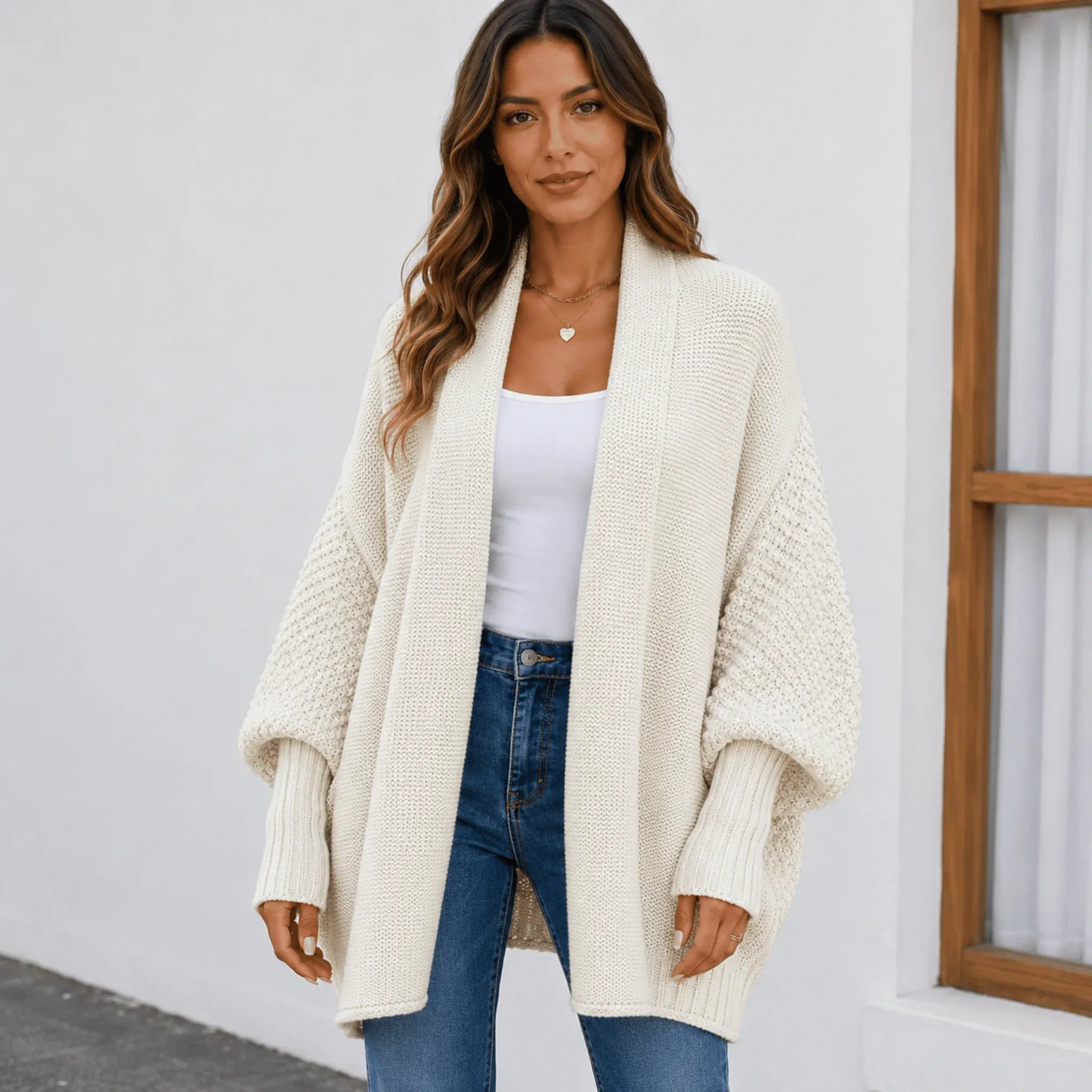 Women's apricot cozy knitted lapel cardigan sweater featuring an oversized fit, textured knit, and open-front design.