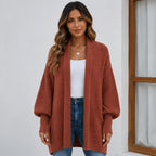 Women's brick red cozy knitted lapel cardigan sweater featuring a soft textured knit and relaxed everyday fit.