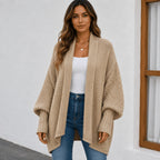 Women's camel knitted lapel cardigan sweater with an oversized fit, open-front styling, and cozy knit construction.