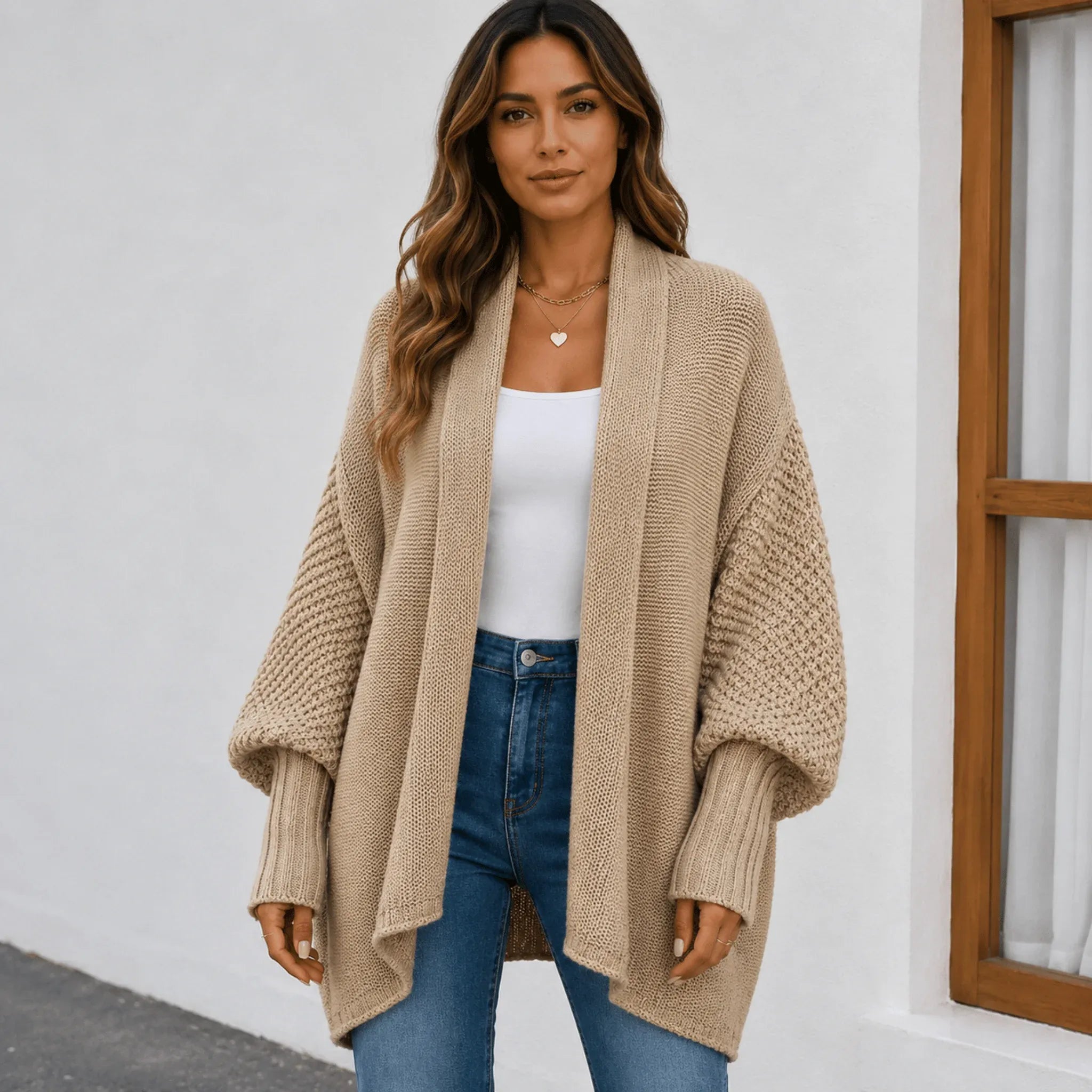 Women's camel knitted lapel cardigan sweater with an oversized fit, open-front styling, and cozy knit construction.