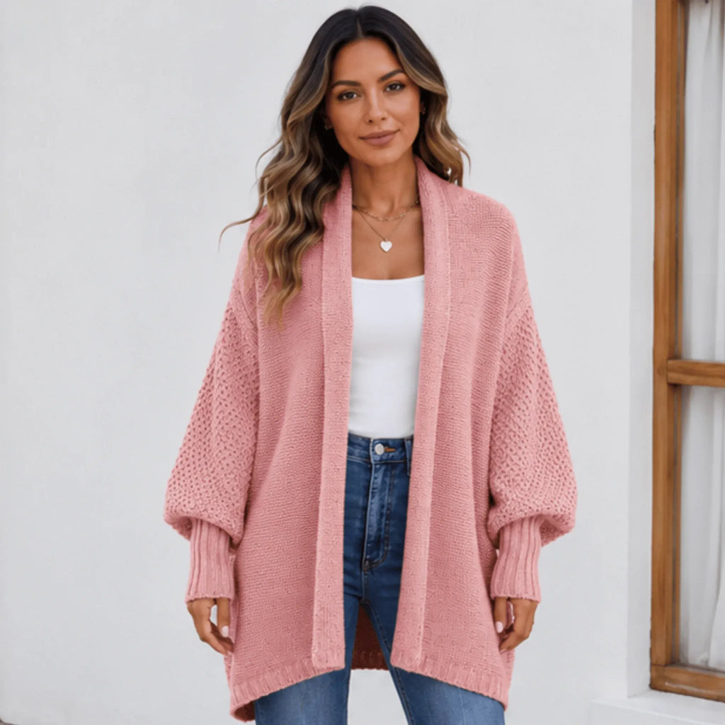 Women's pink cozy knitted lapel cardigan sweater featuring an oversized fit, open front, and soft textured knit.
