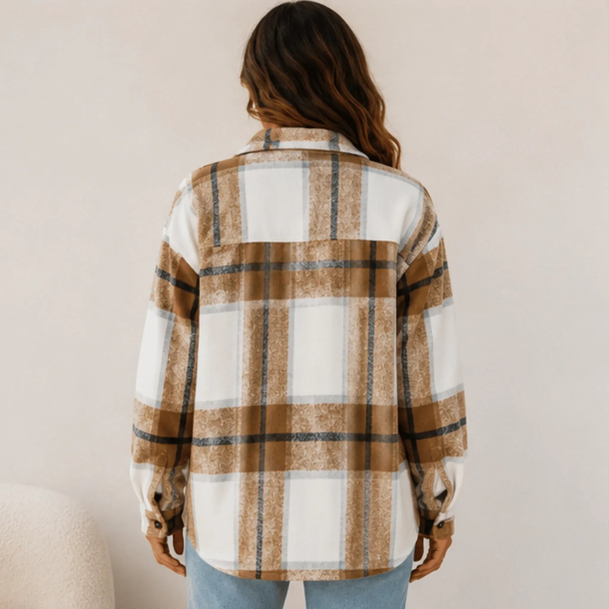 Back view of the women's khaki plaid button down shacket featuring an oversized fit, long sleeves, and rounded hem.