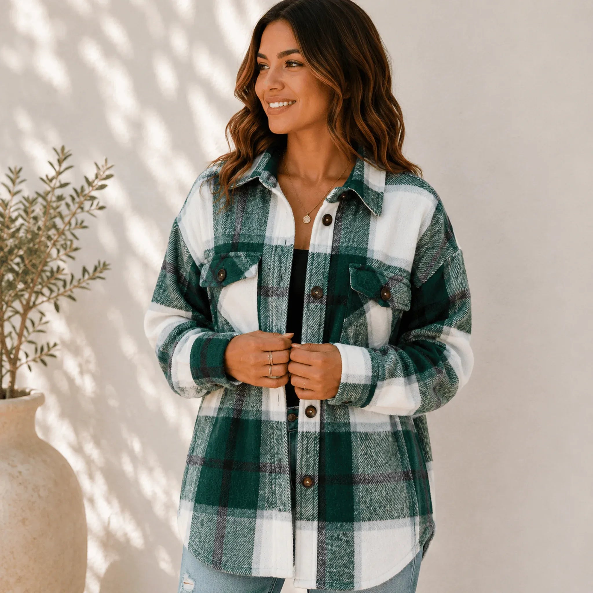 Women's green plaid button down shacket with a loose fit, button-front closure, collared design, and cozy brushed fabric.