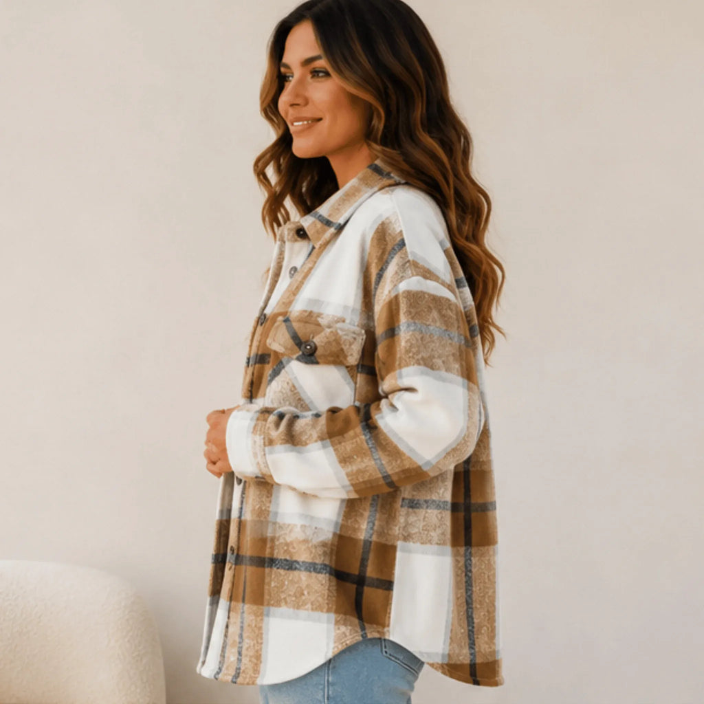 Side view of the women's khaki plaid button down shacket showcasing its relaxed fit, curved hem, and cozy layering style.