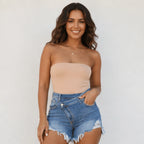 Front view of women's Criss Cross High Waist Distressed Denim Shorts in light blue featuring a crossover waistband, distressed details, and frayed hem.