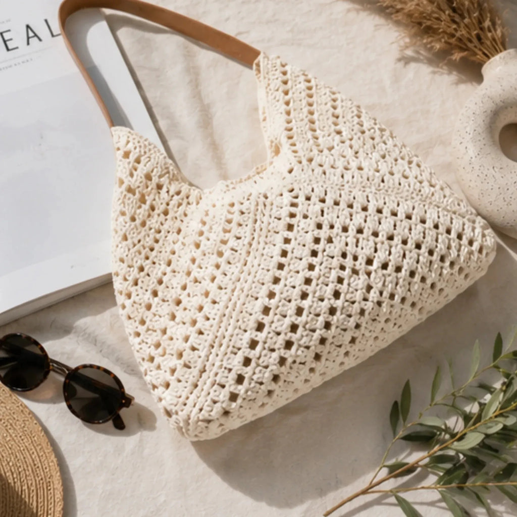 Flat lay of the Crochet Shoulder Bag With Pouch in natural showcasing the handcrafted-inspired crochet weave, faux leather handles, and spacious tote design.