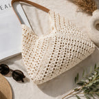 Flat lay of the Crochet Shoulder Bag With Pouch in natural showcasing the handcrafted-inspired crochet weave, faux leather handles, and spacious tote design.