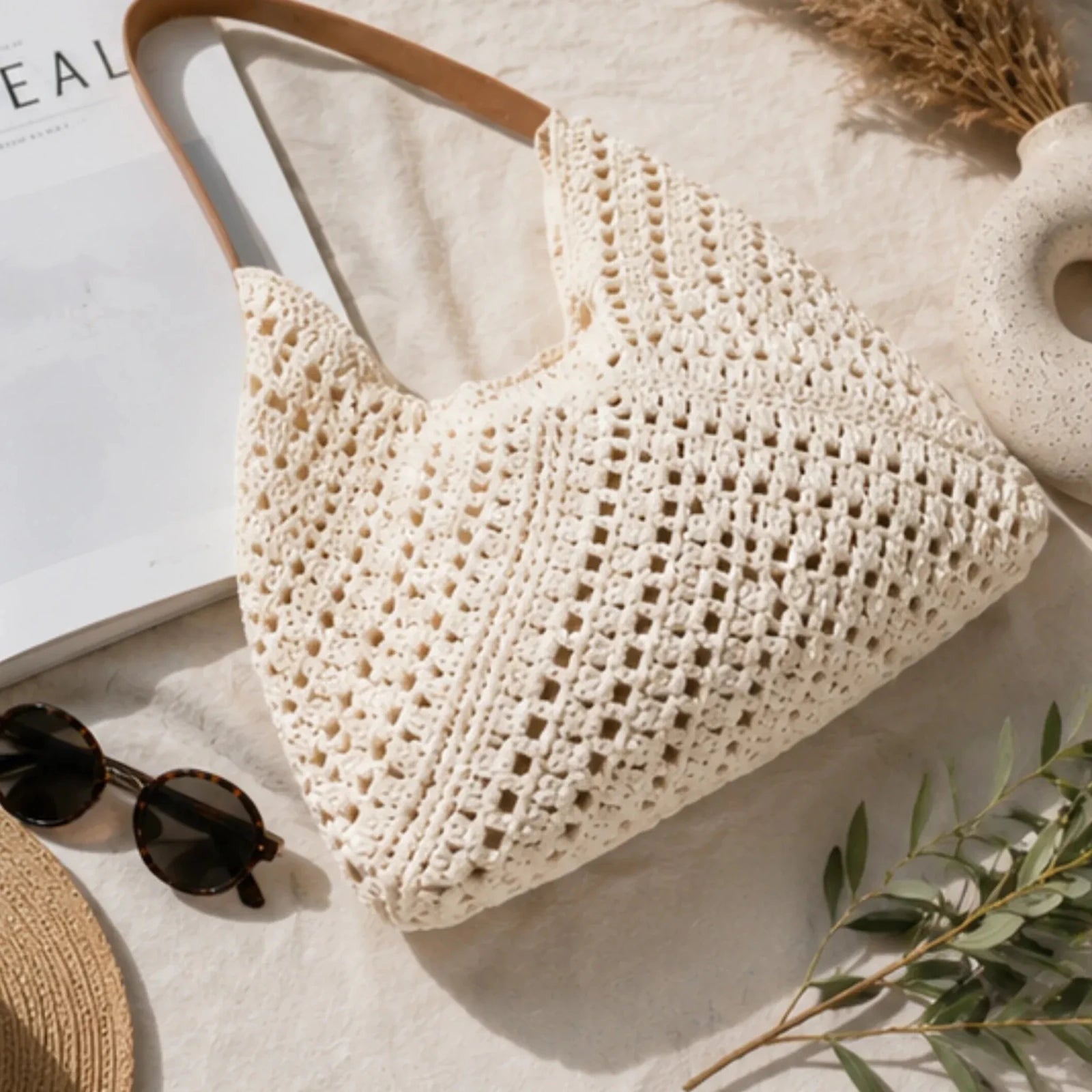 Flat lay of the Crochet Shoulder Bag With Pouch in natural showcasing the handcrafted-inspired crochet weave, faux leather handles, and spacious tote design.