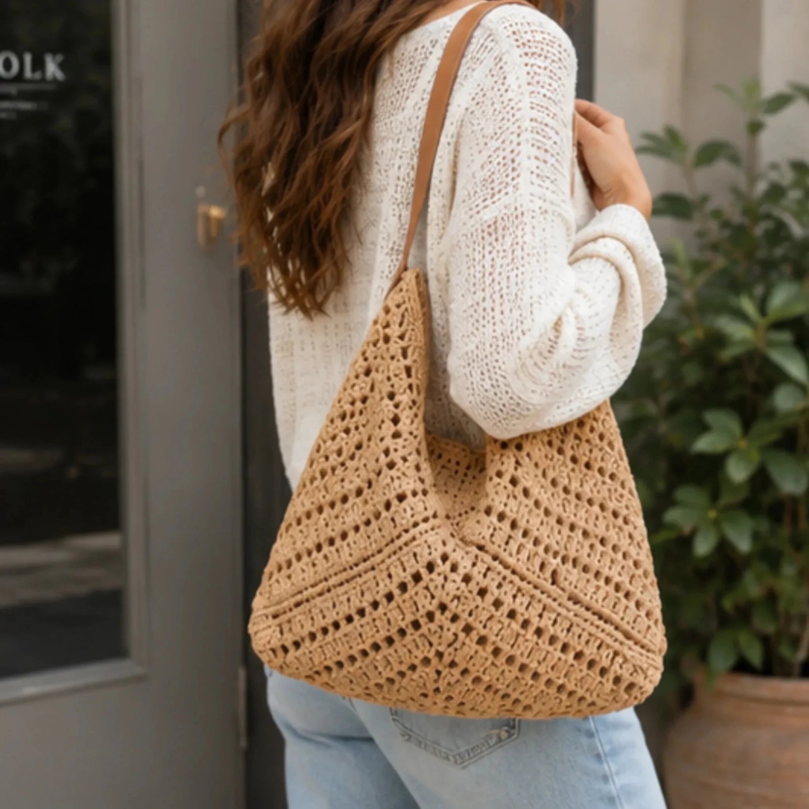 Crochet Shoulder Bag With Pouch in camel featuring an open-knit woven design, faux leather shoulder straps, and a spacious boho silhouette carried over the shoulder.