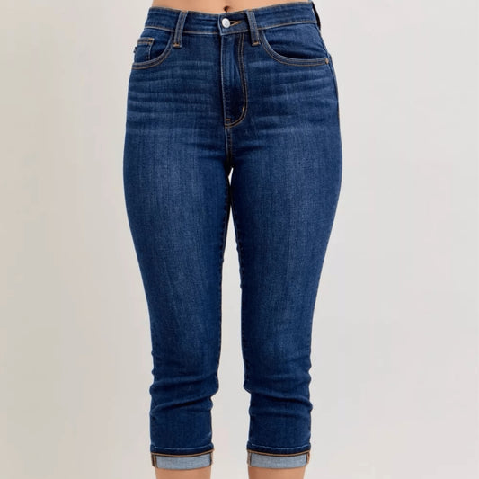 Frontal view of high-waist cuffed capri jeans showing the flattering rise.