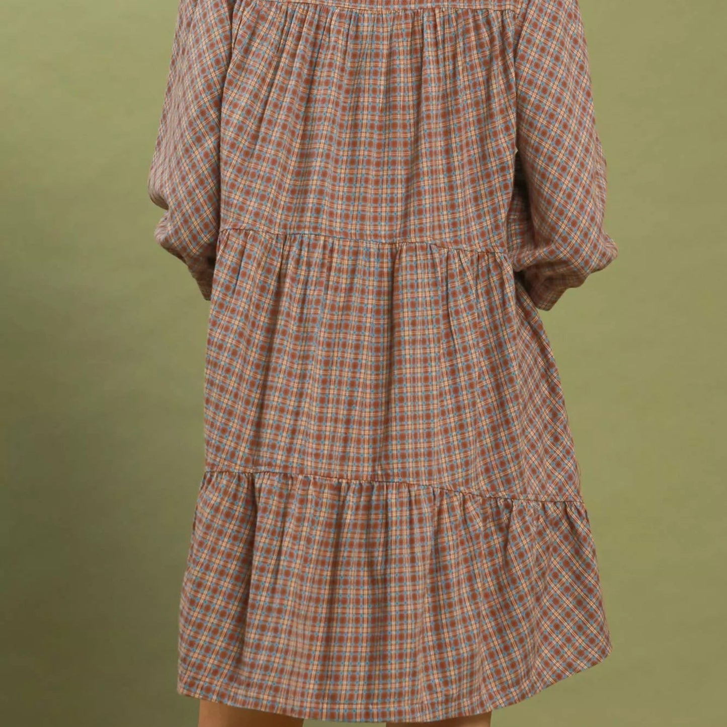 Back view of the brown plaid oversized shirt dress showing length and fit from Solazura Boutique