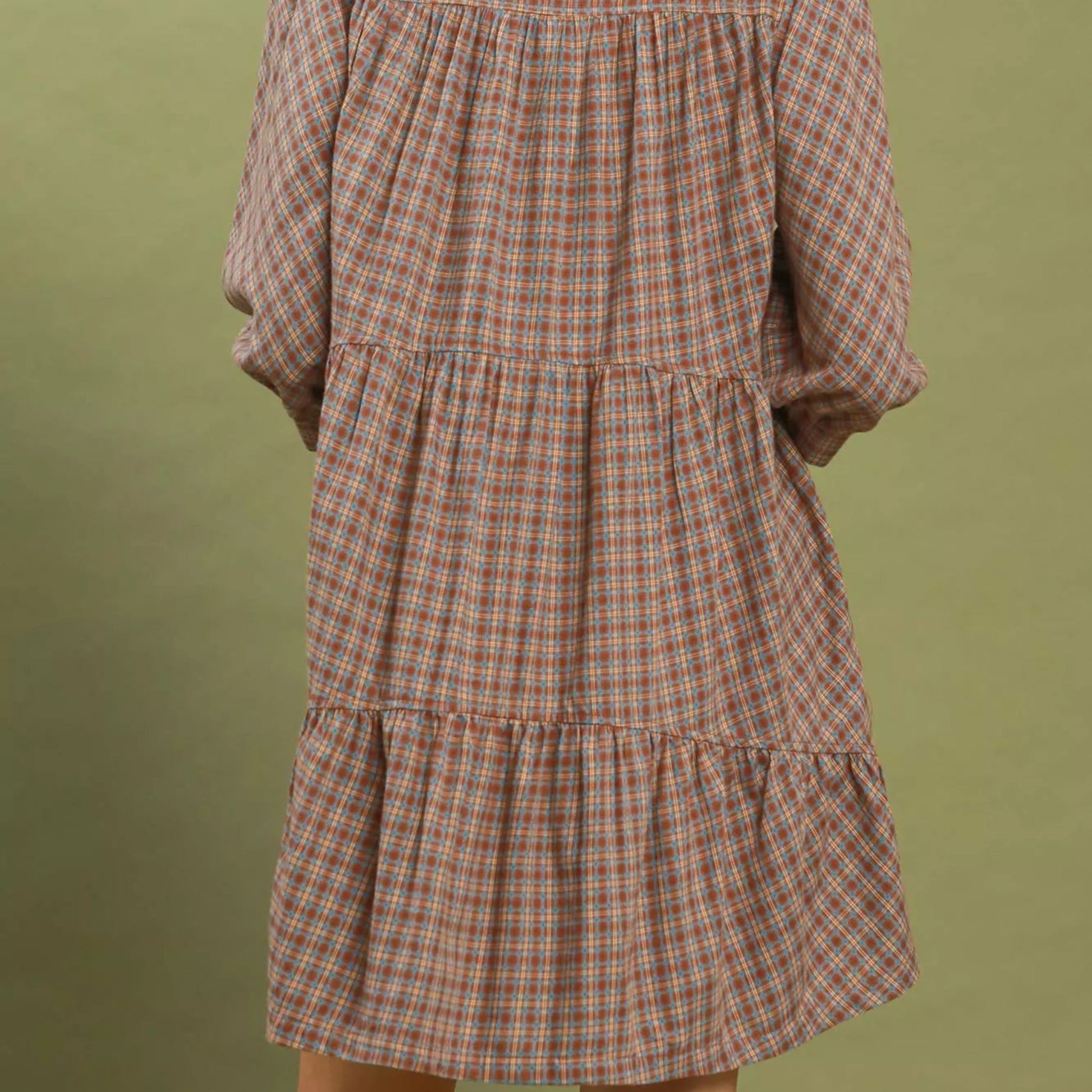 Back view of the brown plaid oversized shirt dress showing length and fit from Solazura Boutique