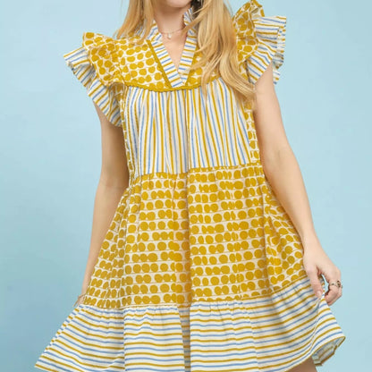 Front view of a loose flowing casual Umgee mixed patchwork tiered dress from Solazura Boutique