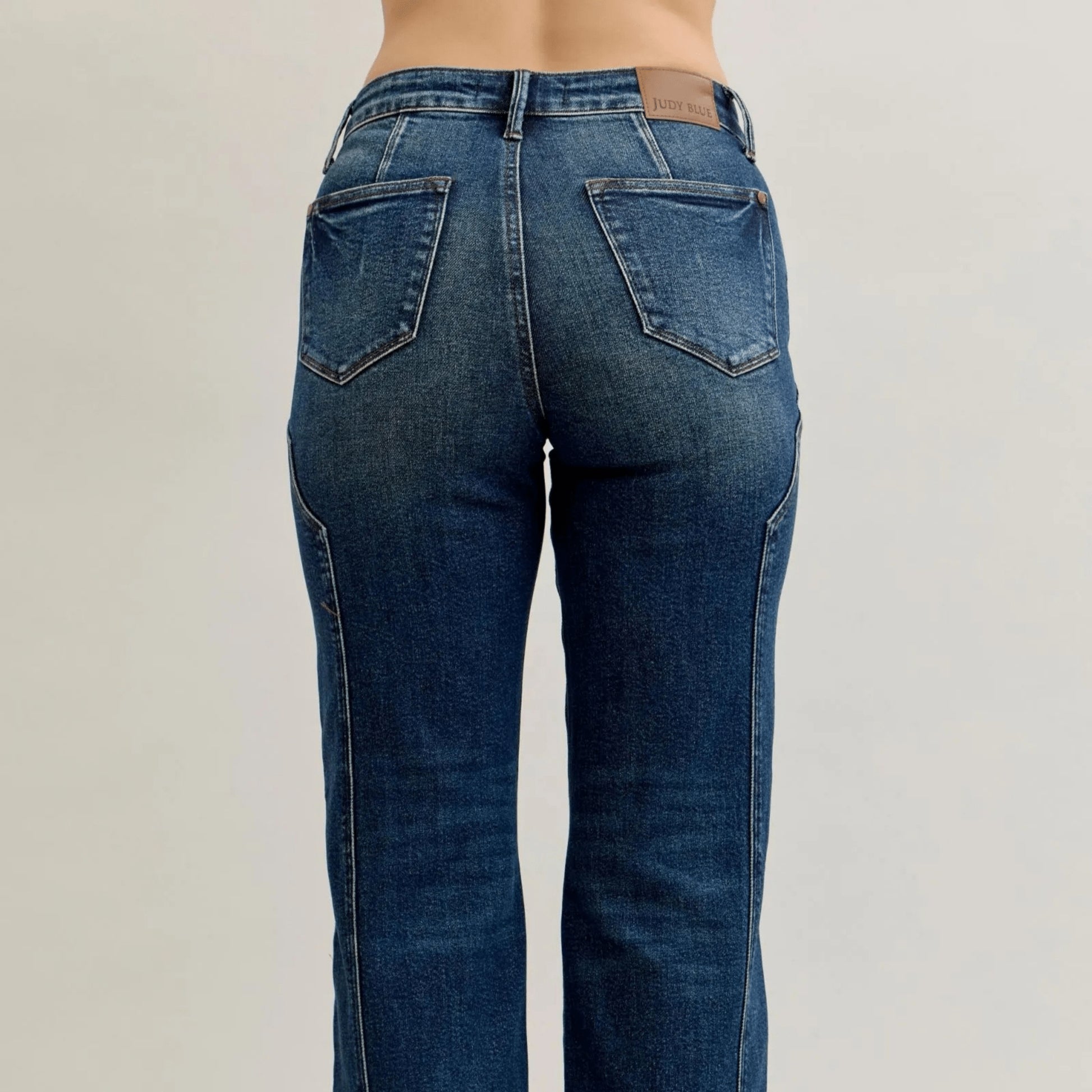 Back view of high-waist straight-leg jeans showing the classic 5-pocket design and wash.